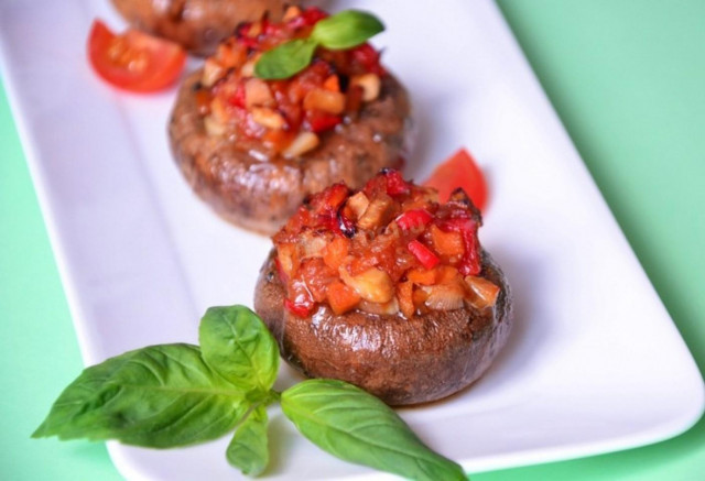 Stuffed mushrooms with tomatoes in the oven