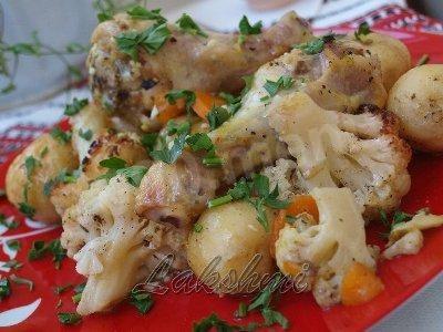Chicken with potatoes and cauliflower in oven