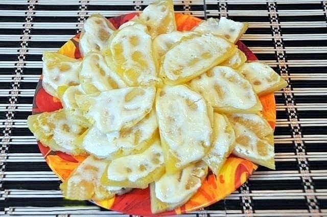 Pineapple with sour cream baked in the oven