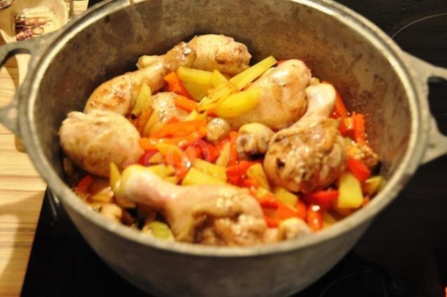 chicken legs with mushrooms in oven in a pot
