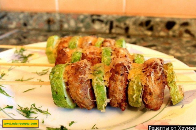 Kebabs of zucchini with minced meat in the oven