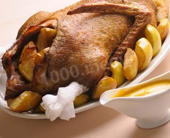 Goose with apples baked in the oven