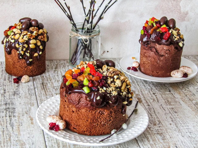 Chocolate cake with chocolate glaze nuts and candied fruits