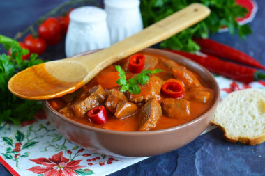 Beef goulash in a slow cooker with gravy