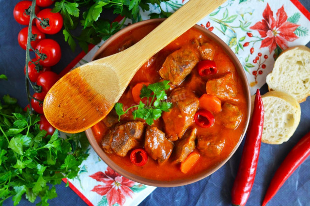 Beef goulash in a slow cooker with gravy