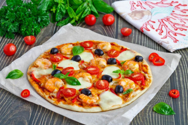 Homemade pizza with shrimp and cheese