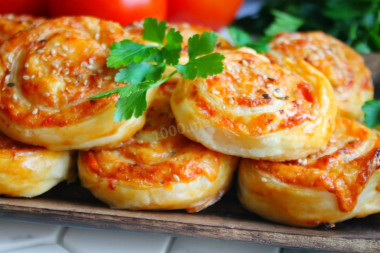 Puff pastry rolls with cheese and sausage