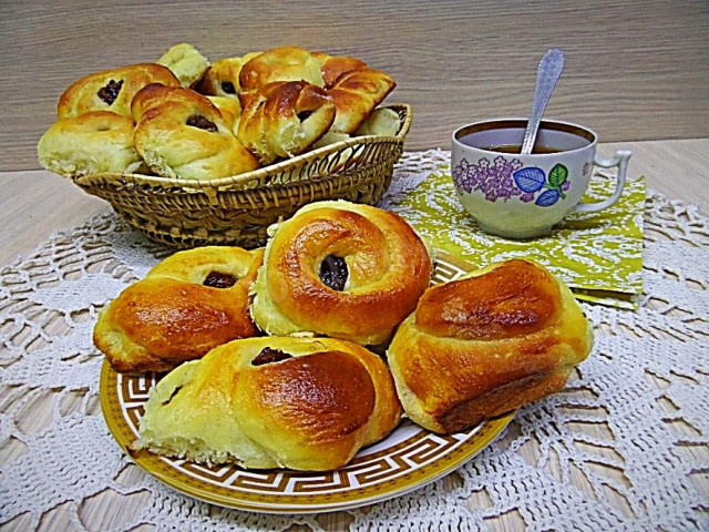 Buns with dried apricots from yeast dough
