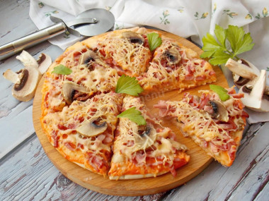 Pizza with sausage, mushrooms and cheese