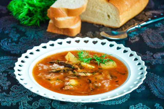 Sprat soup in tomato sauce with potatoes and rice