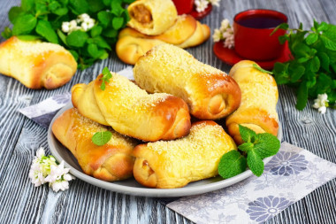 Buns with condensed milk boiled from yeast dough