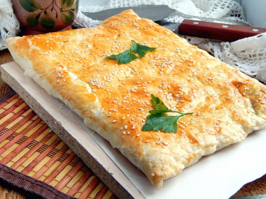 Puff pastry pie with minced meat and potatoes