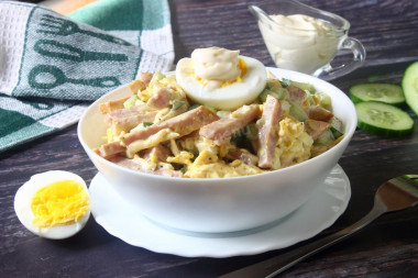 Salad with ham, cucumbers, cheese and egg
