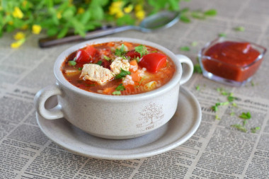 Soup with rice, tomato paste and chicken