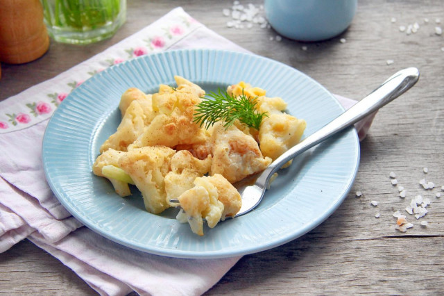 Cauliflower with egg in a frying pan