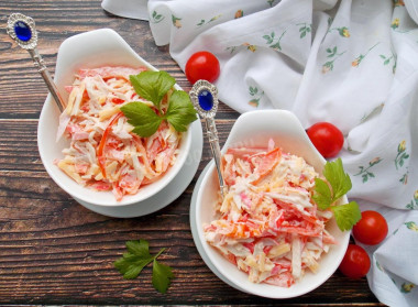 Salad with bell pepper, crab sticks and tomatoes