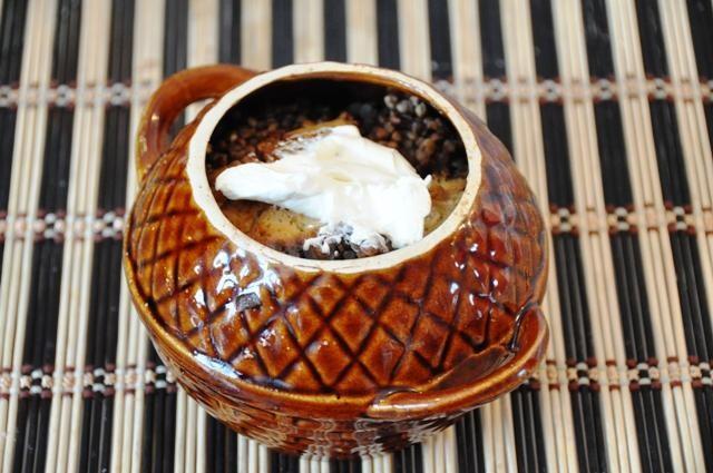 Baked duck in a pot with buckwheat