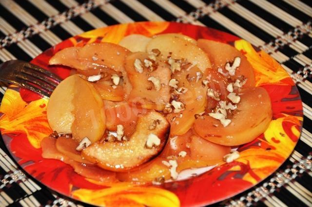 Baked quince with walnuts hot dessert