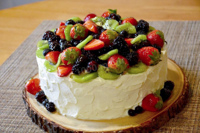 Sponge cake with cottage cheese cream decoration with berries and fruits