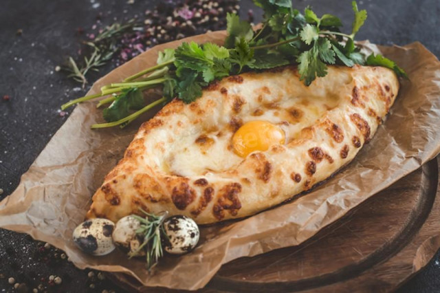 Khachapuri on a ready-made dough with Adjarian brine cheese egg