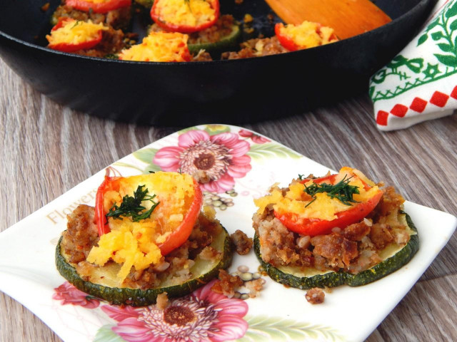 Young zucchini towers baked with tomatoes and cheese