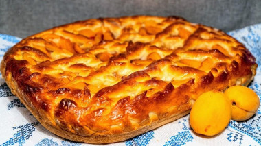 Yeast pie with apricots and jam on kefir