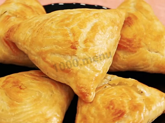 Samsa made of puff pastry in butter with minced meat