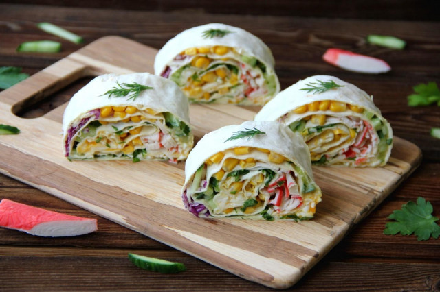 Pita bread roll with crab sticks and egg