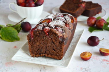 Chocolate cupcake with milk and plums