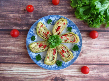 Zucchini roll with tomatoes and cheese