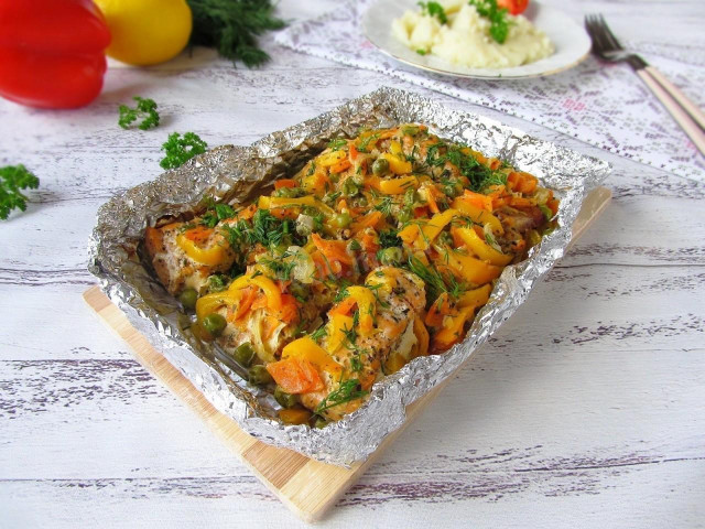 Red fish with vegetables baked in foil