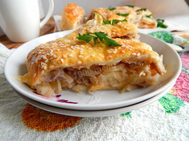 Unsweetened Strudel roll with potatoes, meat and cabbage