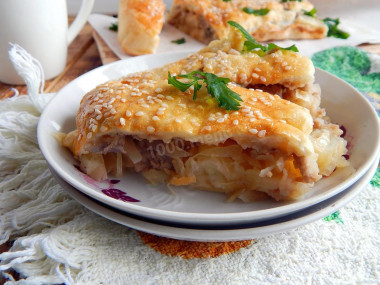 Unsweetened Strudel roll with potatoes, meat and cabbage