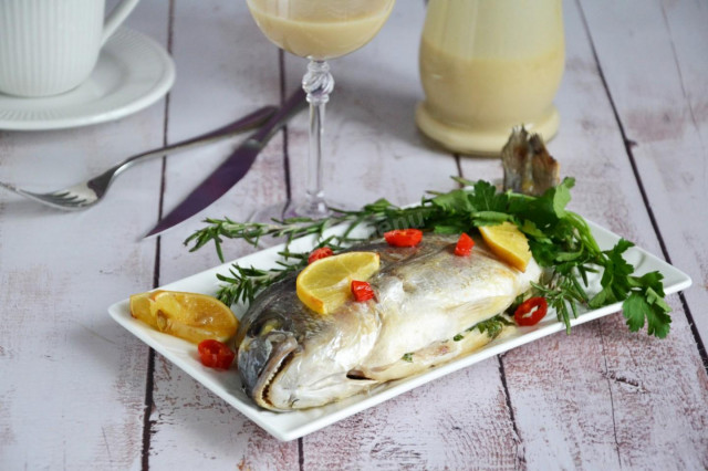 Dorada with lemon and herbs in foil