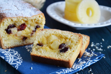 Coconut cupcake with pineapple and dried cranberries