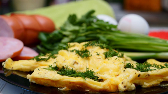 Omelet with cheese and herbs in milk