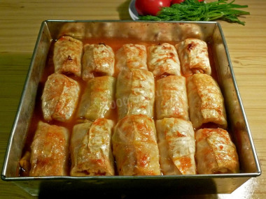 Stuffed cabbage rolls with minced meat in the oven in tomato sauce