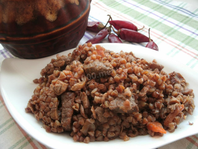 Buckwheat with meat and mushrooms in a pot