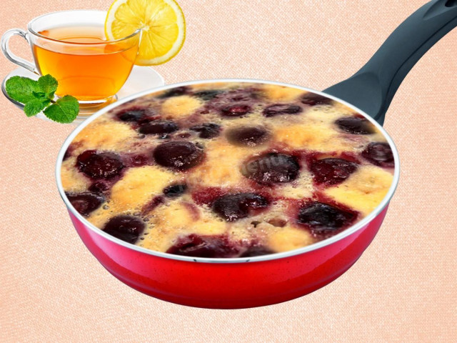 Clafouti with cherries in a frying pan