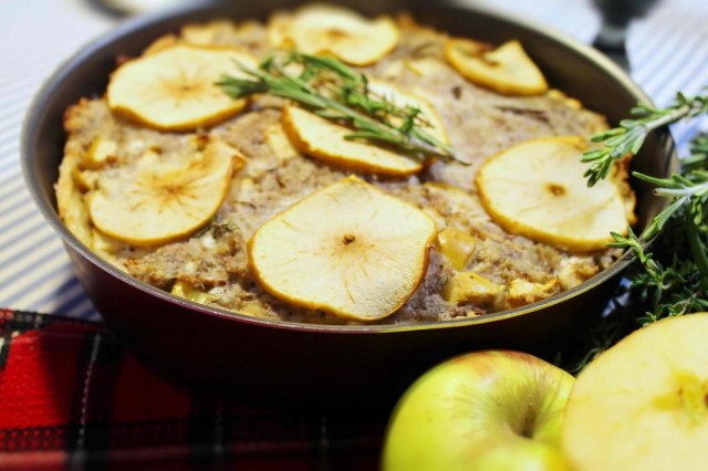 Autumn pie with pork apples and herbs