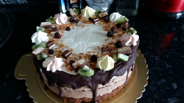 Three chocolate cake with vanilla, baileys and fruits