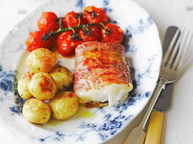 Baked limonella with potatoes and cherry tomatoes