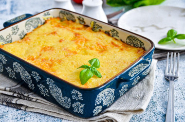 Potato casserole with minced meat and cheese in oven