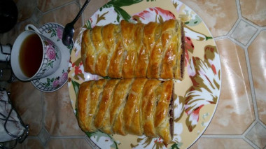 Puff pastry roll with chocolate and nuts