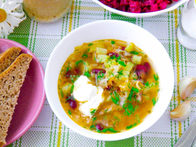 Lean cabbage soup with canned beans and cabbage