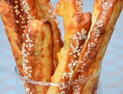 Cheese sticks with sesame seeds