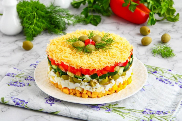 Salad with egg cheese corn and cucumber