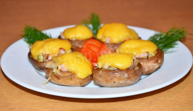 Stuffed mushrooms under a cheese hat New Year's Eve