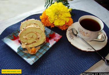 Sponge roll with cottage cheese filling and nuts