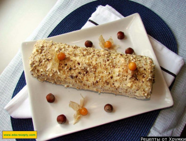 Sponge roll with cottage cheese filling and nuts